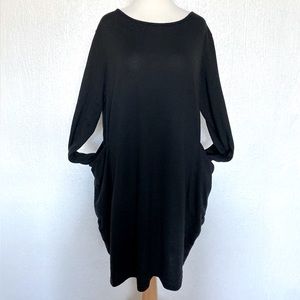 Black knit midi dress with pockets and long sleeves